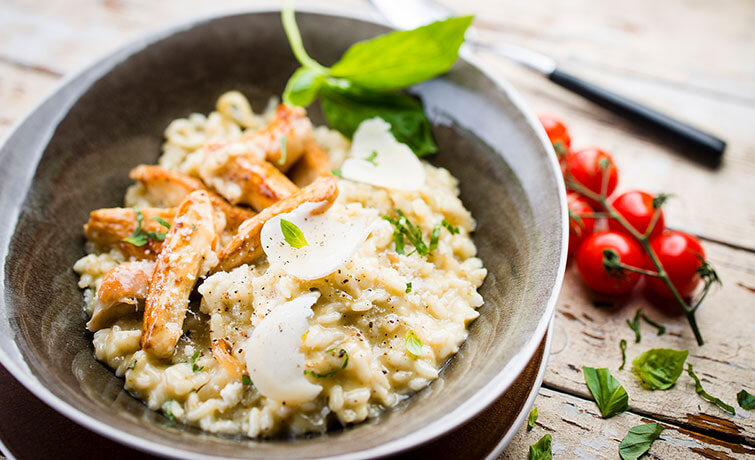 Bowl of Chicken Peso Risotto on a wooden table