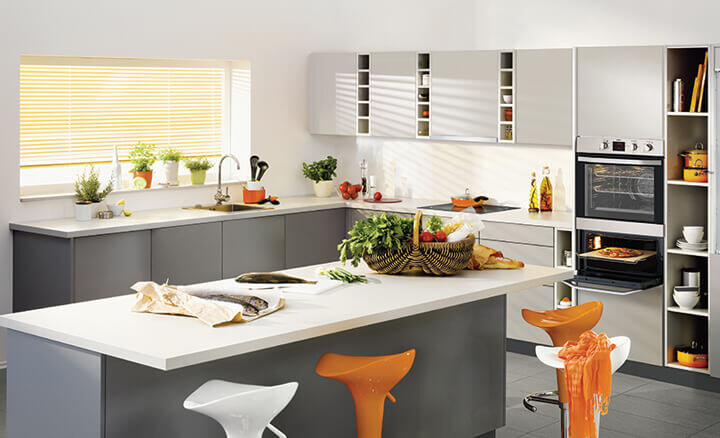 Modern kitchen with island layout featuring Chef Appliances and bright kitchen accessories