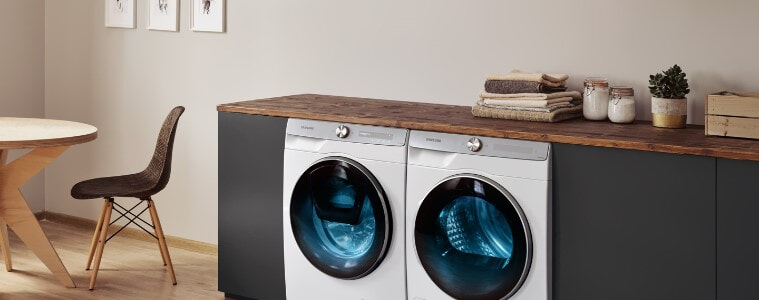 A washer and dryer set-up in a kitchen.