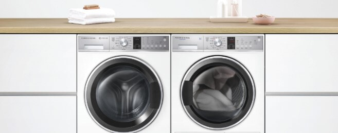 A washer and dryer sit side-by-side in a laundry