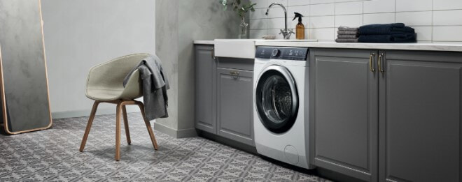A grey-toned laundry with lots of storage space
