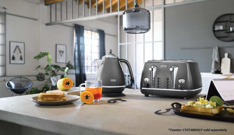 Charcoal Delonghi kettle and toaster with fresh healthy food on a modern kitchen benchtop