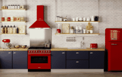 A red Smeg Portofino oven and rangehoods in a modern kitchen.