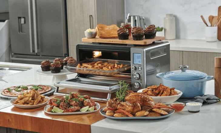 Breville air fryer on a modern benchtop surrounded by delicious food