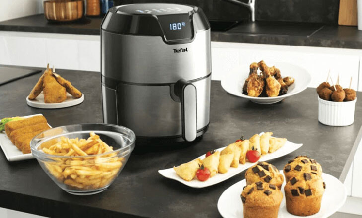Tefal Air Fryer surrounded by delicious food