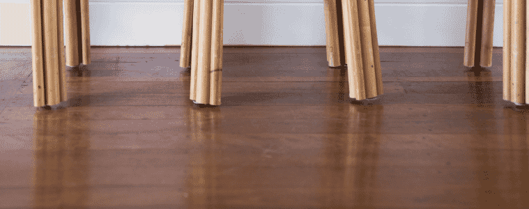 Closeup of walnut coloured timber flooring. 