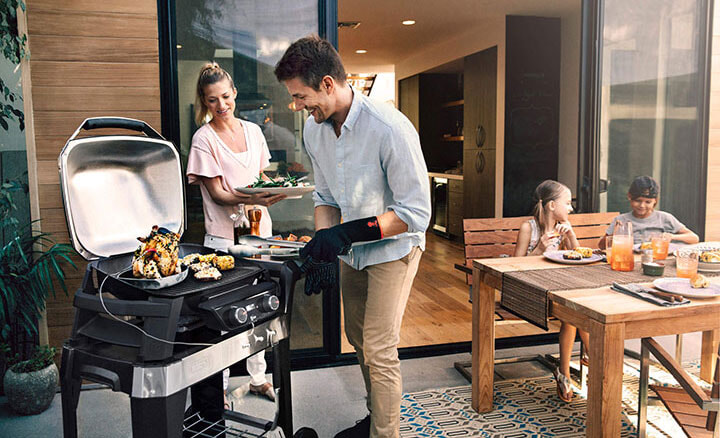 Family enjoying using their BBQ and outdoor area