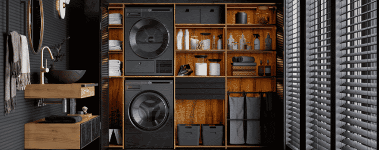 Modern laundry featuring dark laundry appliances to match the wood and charcoal colour palette