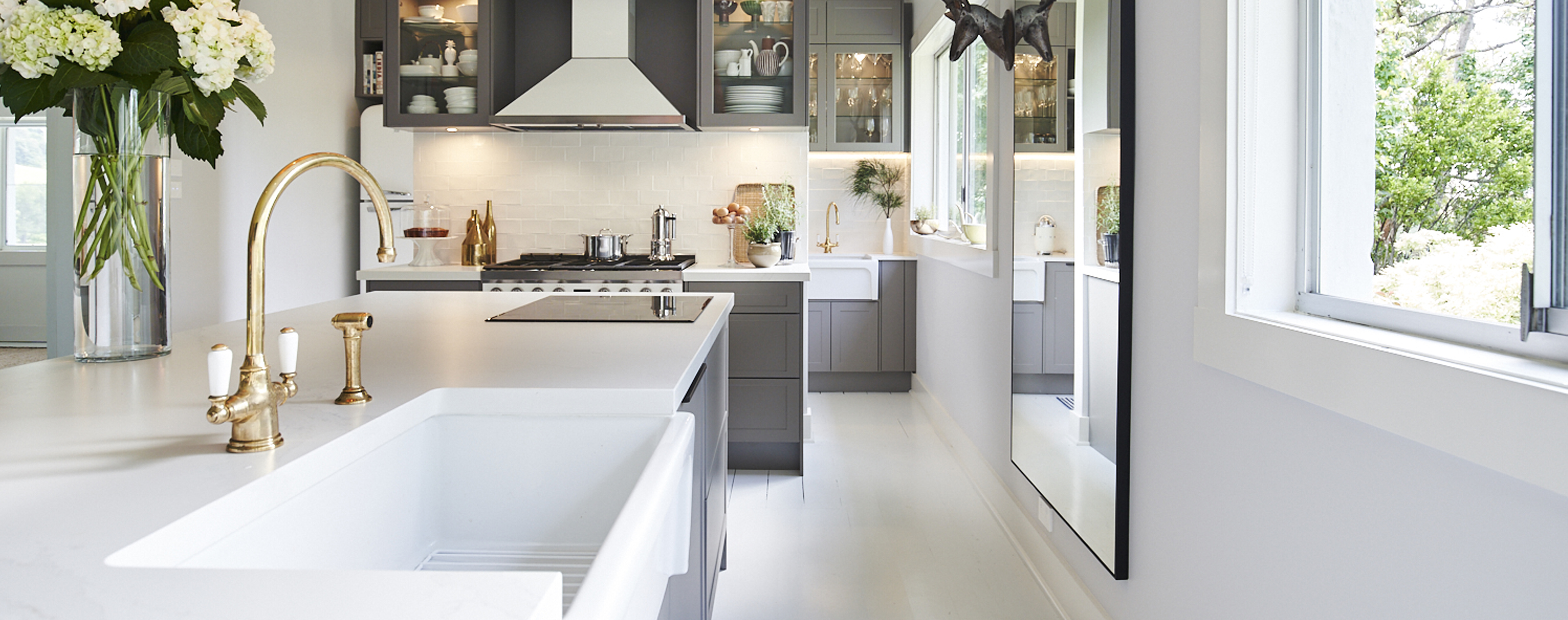 A white stainless-steel kitchen designed by Kinsman