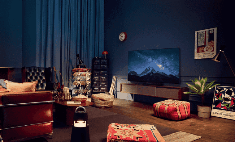 A wide shot of an LG OLED TV in a modern lounge room