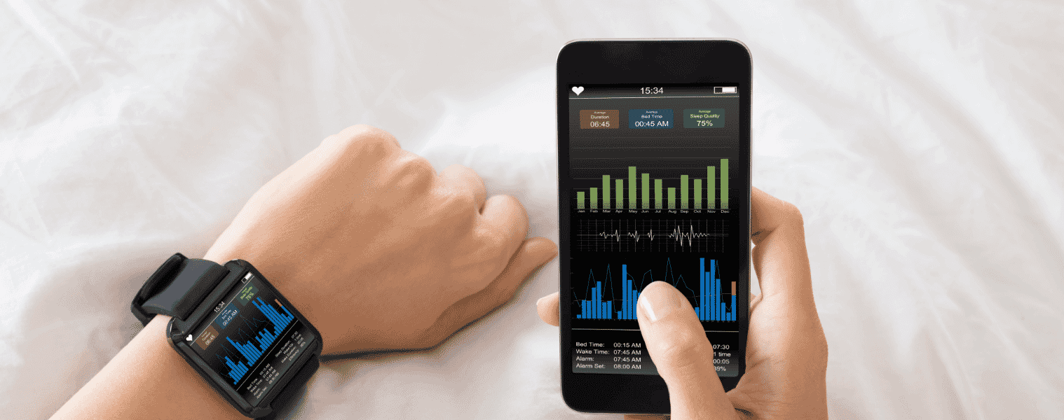 A person tracks their sleep cycle on an app connected to their smartphone and smart watch.