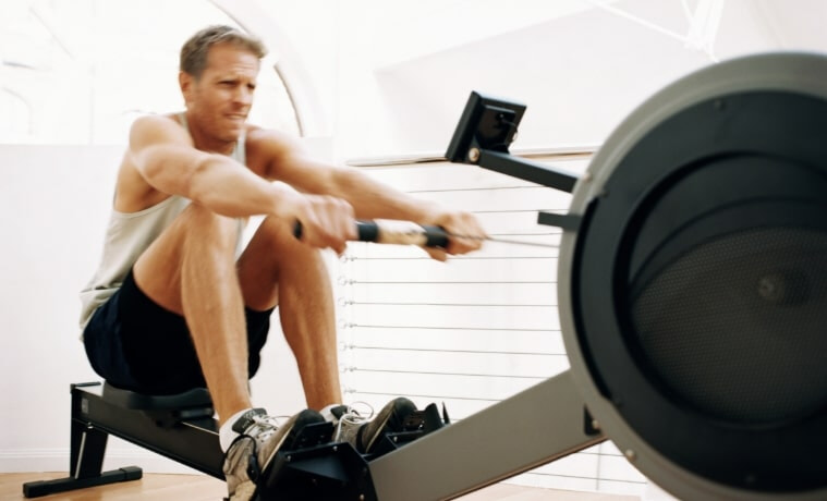 Man enjoying a home workout on his rowing machine