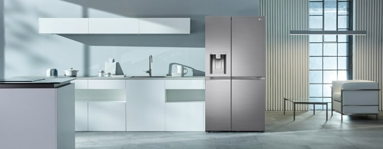 LG stainless steel side-by-side fridge  in a bright kitchen