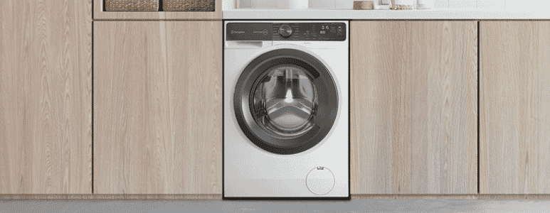 Westinghouse washer dryer combo sitting under laundry benchtop | The Good Guys
