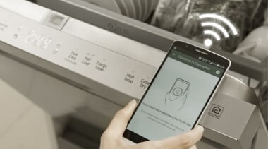 A person connects their smartphone to their dishwasher with the LG ThinQ app.
