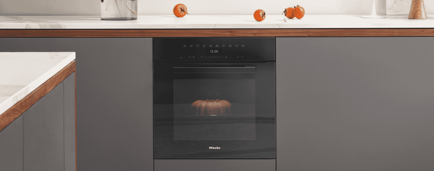 The Miele 60cm Pyrolytic Oven sits in a grey kitchen.
