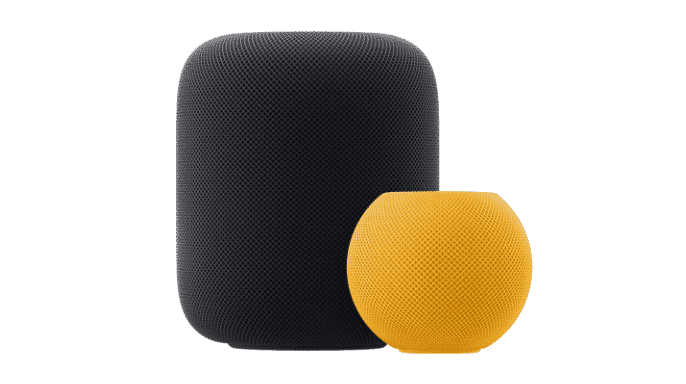 Midnight coloured HomePod situated behind a yellow HomePod mini.