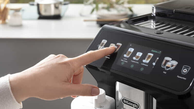 Woman using control panel touch screen on her De'Longhi Coffee Machine.