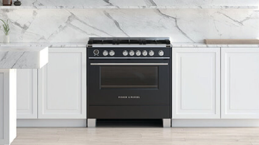 Black Fisher & Paykel freestanding oven in white kitchen