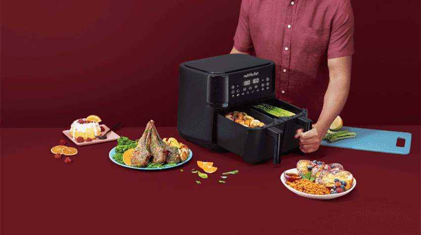 Man using his Twin Drawer air fryer to make a feast