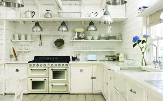 A cream coloured Smeg Victoria oven in a white classically styled kitchen.