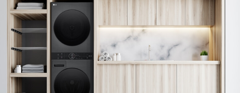 All black new smaller WashTower sitting in marble laundry.