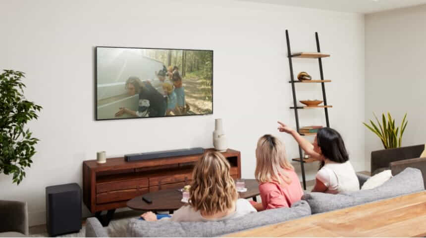 Three women watch TV using their JBL 800 Soundbar.