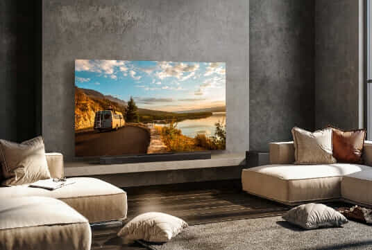 A Big Screen TV mounted on a wall in a modern living room