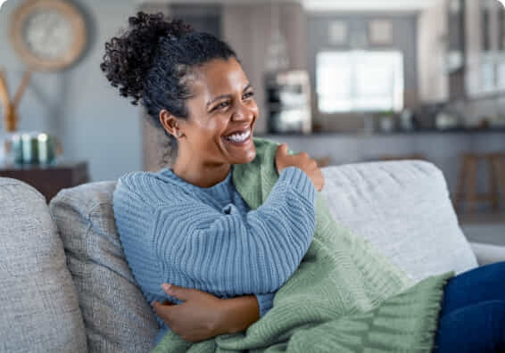woman cosy in her own home.