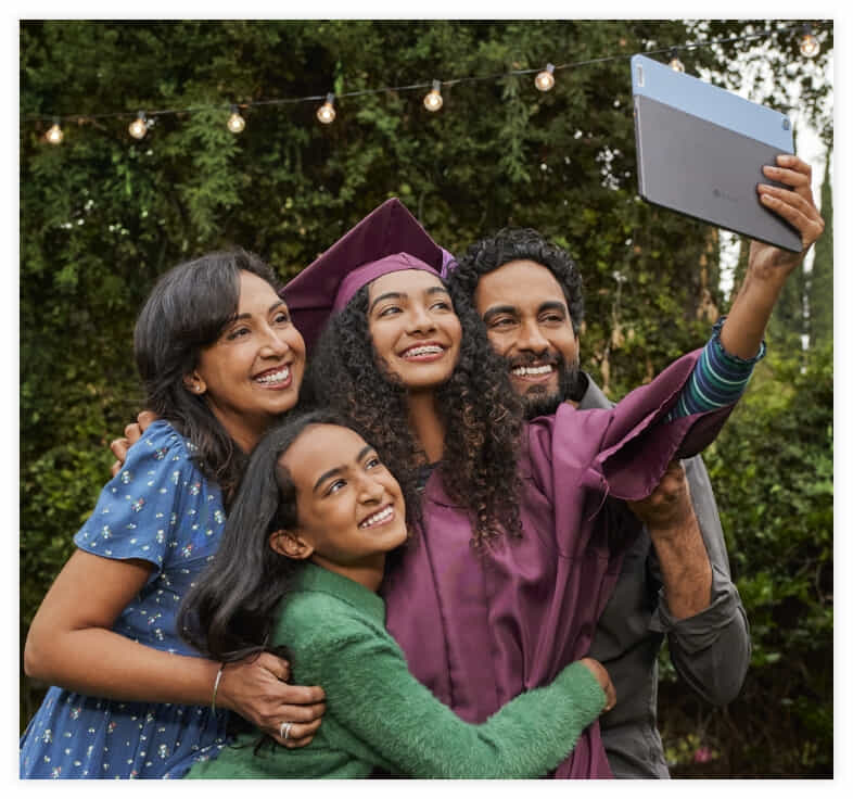 Family take a group selfie at Graduation with a Chromebook.  | The Good Guys