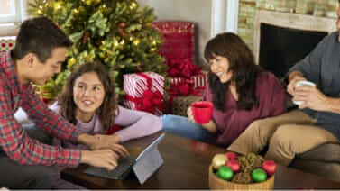 Shot of family using a Chromebook at Christmas.  