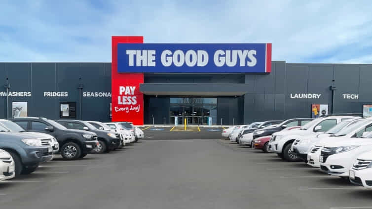Image of the front of a The Good Guys store with cars parked out the front.