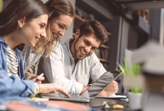 Three students sitting at a table together