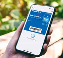 Person holding their phone showing The Good Guys digital wallet. 