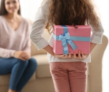 Daughter giving her Mum a gift from The Good Guys