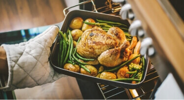 Putting a delicious looking roast into the oven.