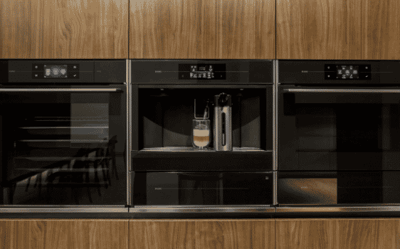 Modern Kitchen Featuring ASKO Dishwasher, Rangehood and Ovens