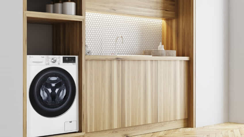 White LG 5-star washing machine in clean timber and white European laundry.