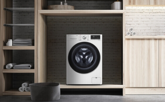 White 5-star energy rated washer by LG in modern laundry.