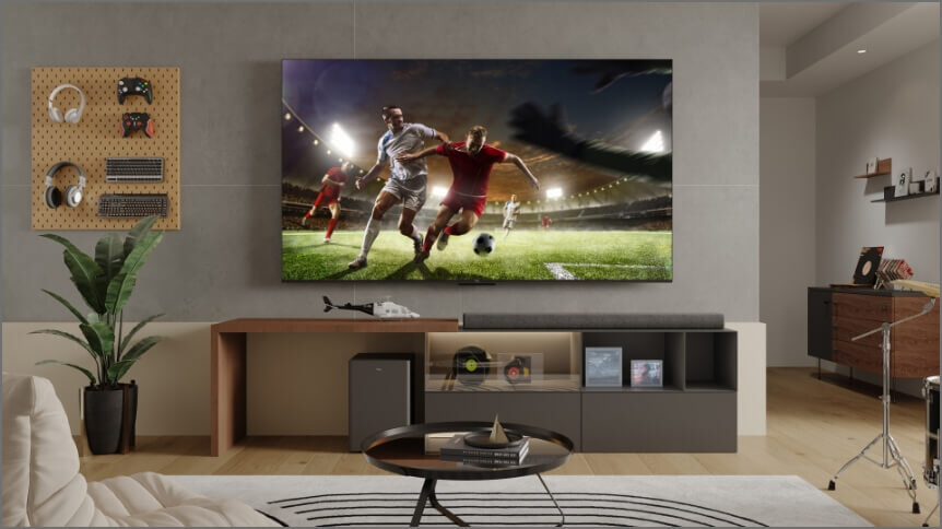 Soccer players chase the ball at the world cup on a TCL C745 TV.