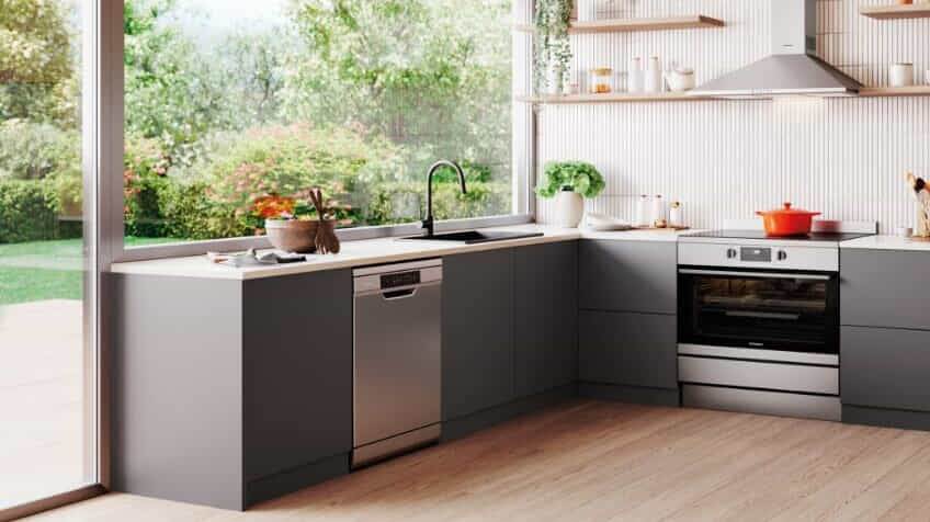 A Westinghouse dishwasher in a grey kitchen.