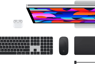 Top view of Mac accessories: Studio Display, AirPods, Magic Keyboard, Magic Mouse and Magic Trackpad