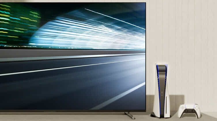 Man loading sheets into his LG WashTower  with his son.