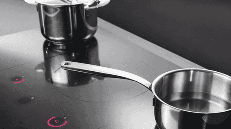 Saucepans situated on an ASKO induction cooktop.