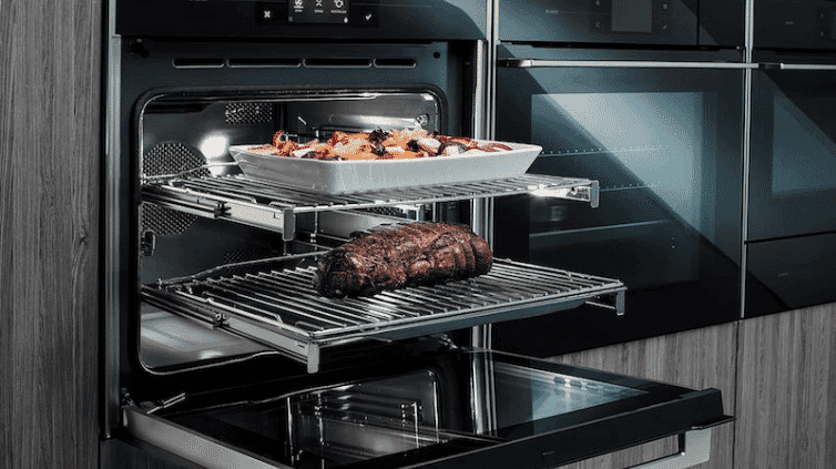 The telescopic arms of an ASKO oven showcasing how they slide in and out.