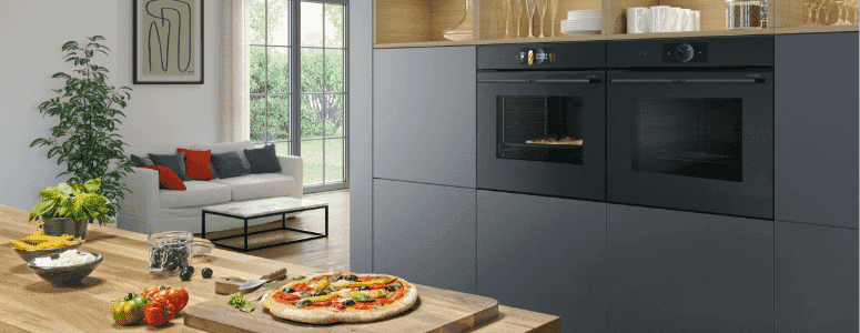 Bosch series 8 ovens in a modern kitchen with cooking pizza