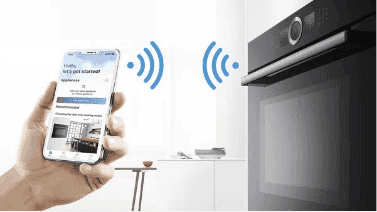 A smartphone connecting to a bosch oven via the bosch home connect app