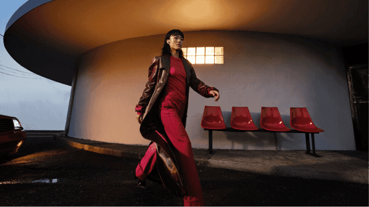 a woman walking while wearing the Bose Ultra Earbuds