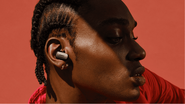 A man wearing the Bose Quietcomfort Ultra Earbuds