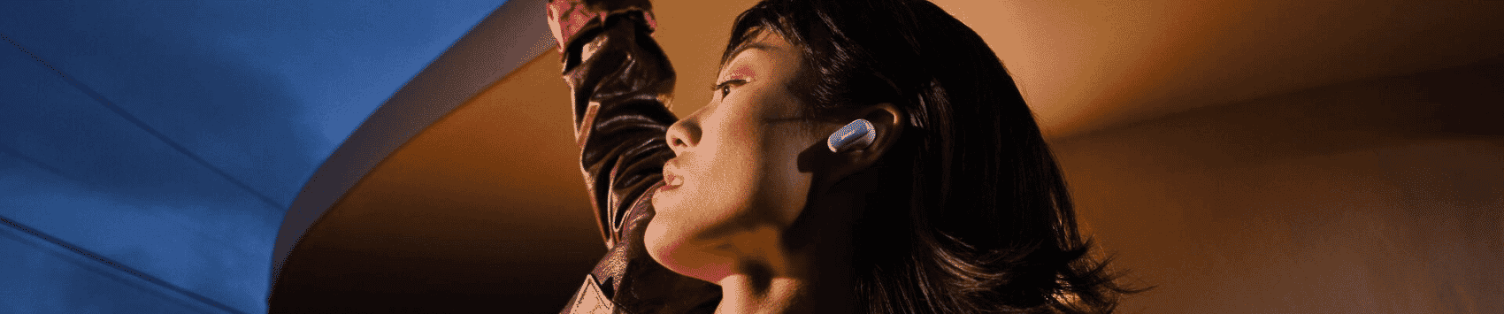 A woman dancing with Bose Ultra Earbuds